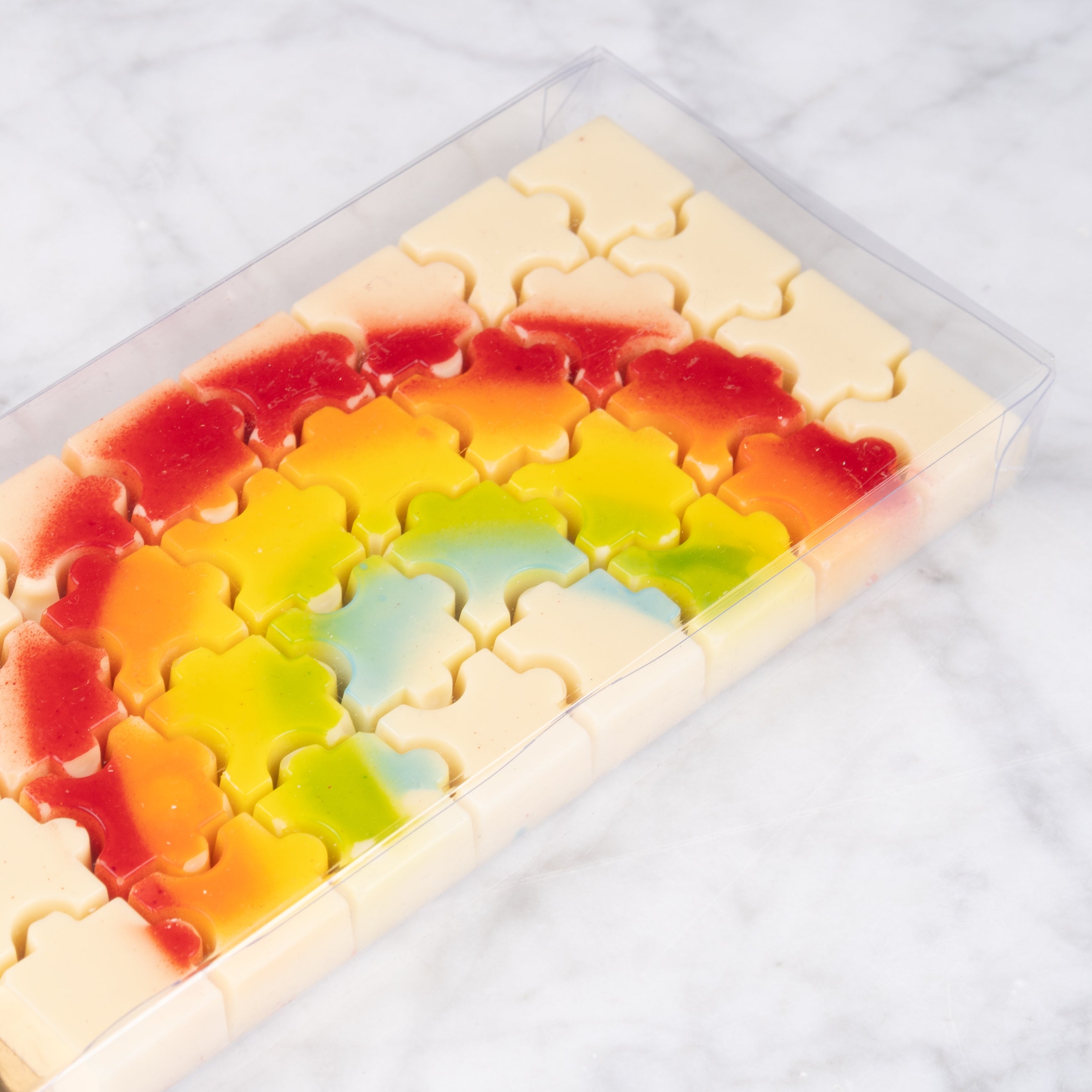 Regenboog chocolade puzzelreep