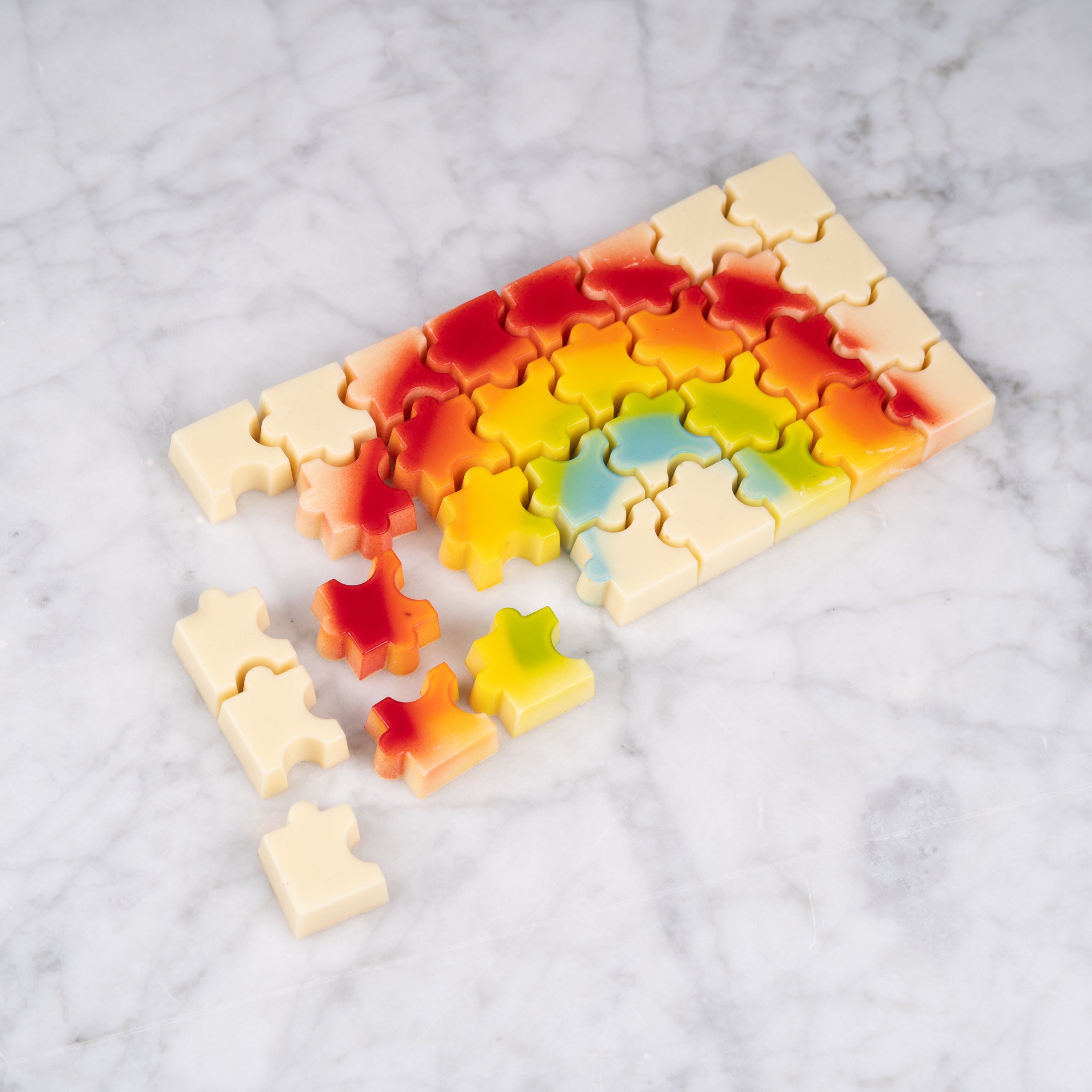 Regenboog chocolade puzzelreep